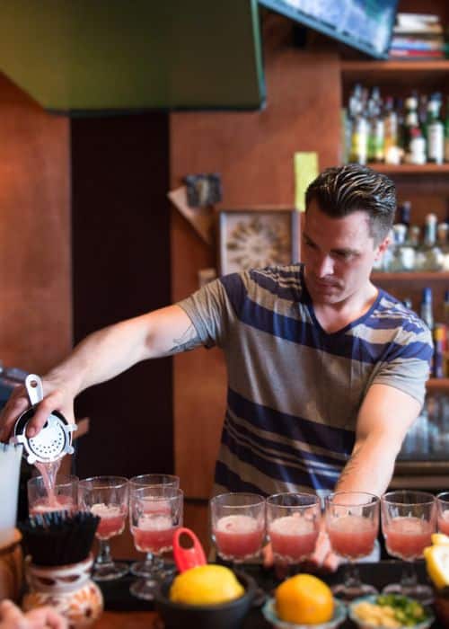 bartender making cocktails during sf birthday party food tour