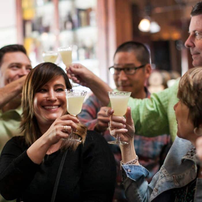 clients toasting cocktails during client entertainment event