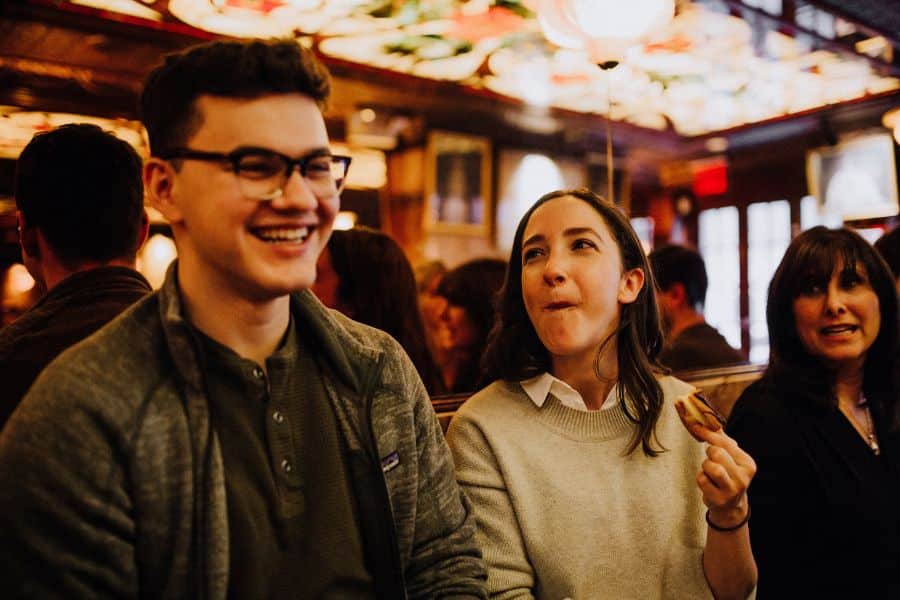 east village food tour guests eating italian desserts