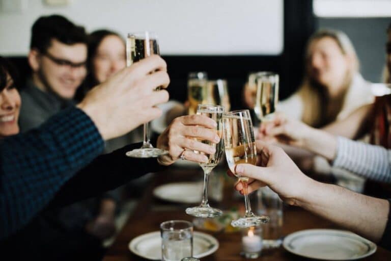 hands toasting champagne