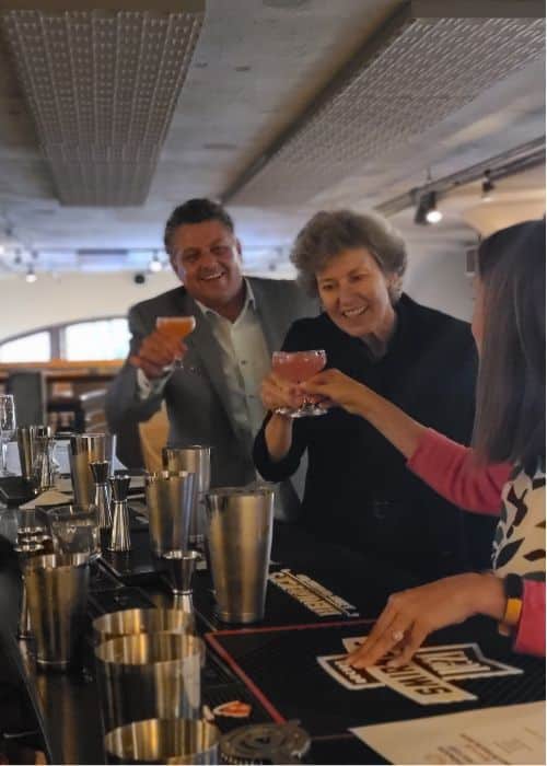 group toasting hands-on cocktail during seattle team building event