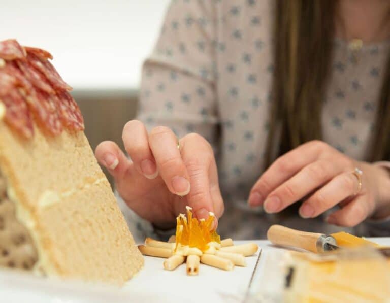 hands making fire using dried oranges