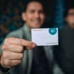 man holding up card during team building game