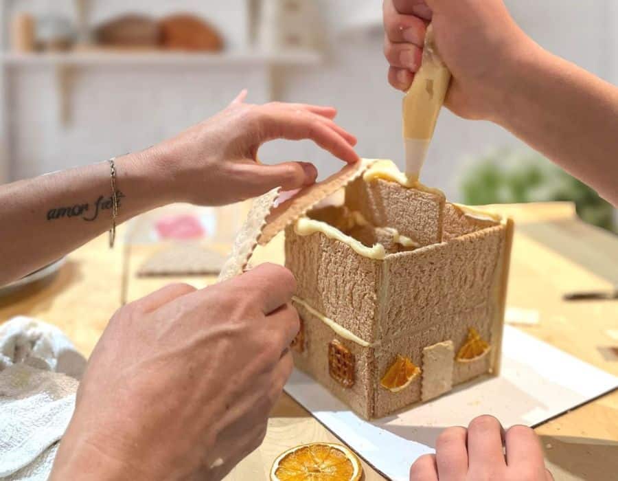 mom and child working on charcuterie chalet experience kit