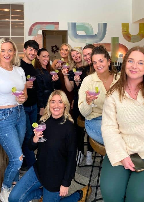 team holding cocktails during nyc private dining event