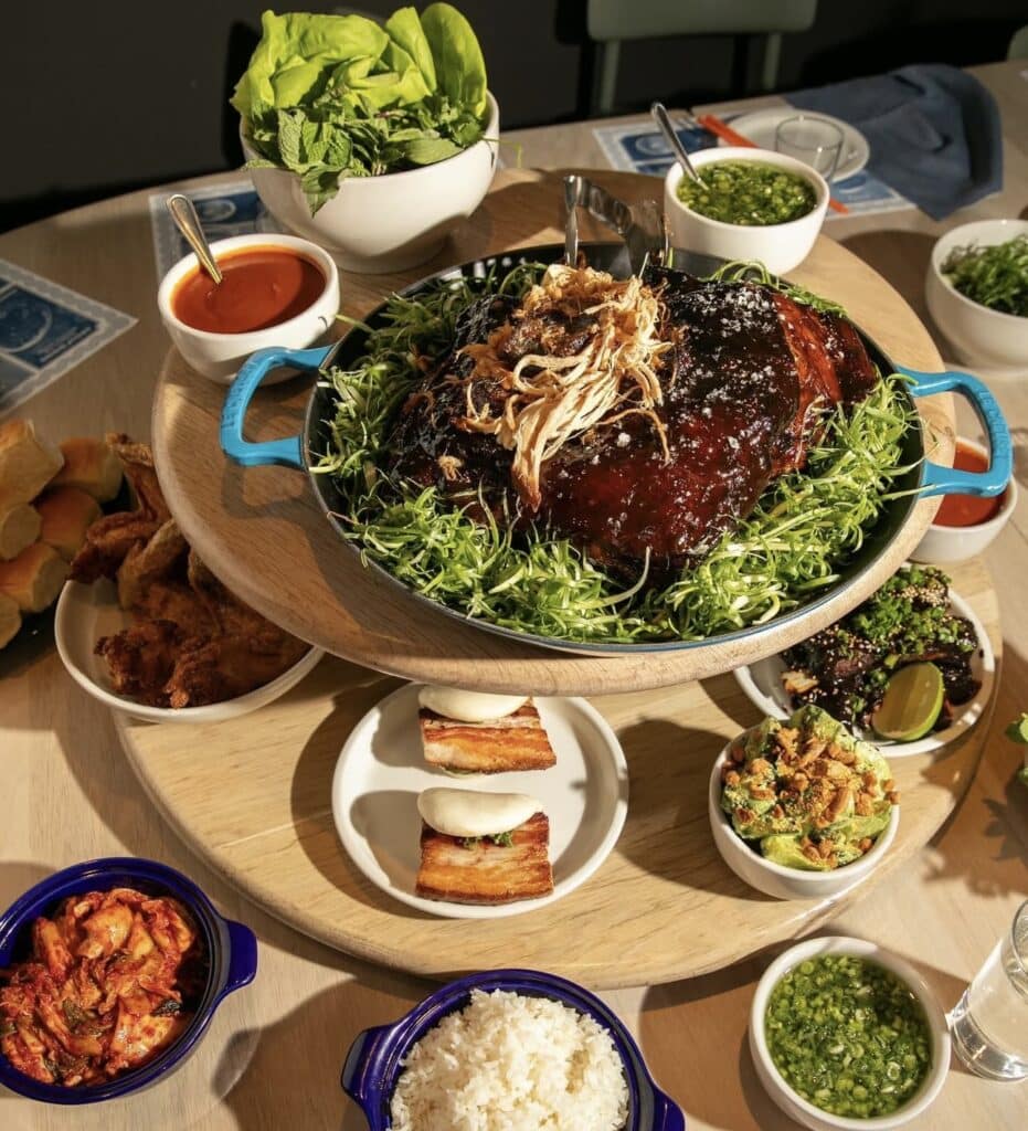 tower of food served at momofuku in nyc