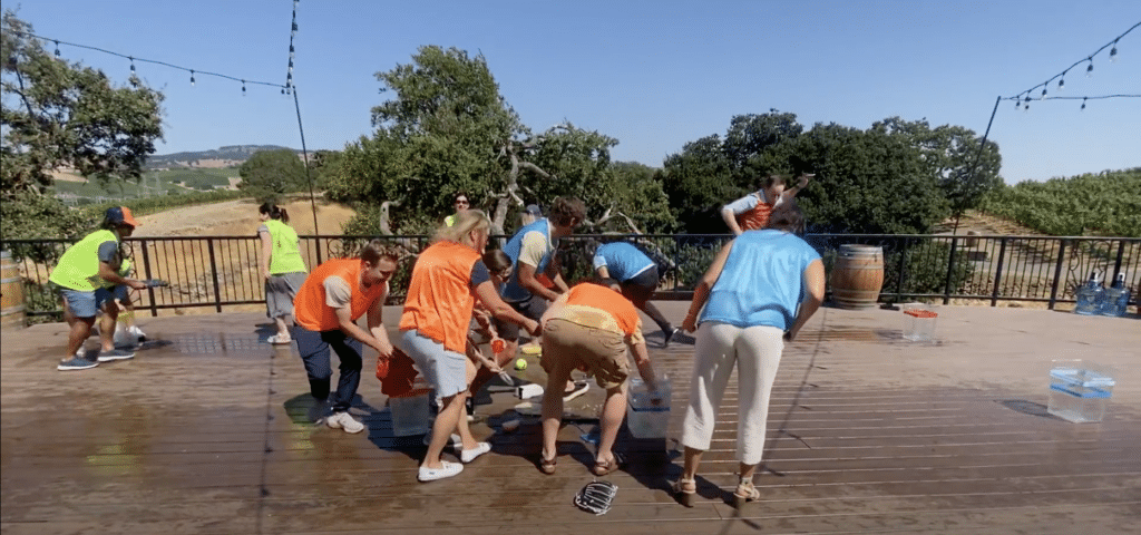 group playing water games during water tasting team building