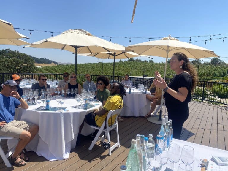 water sommelier talking to group during guided water tasting