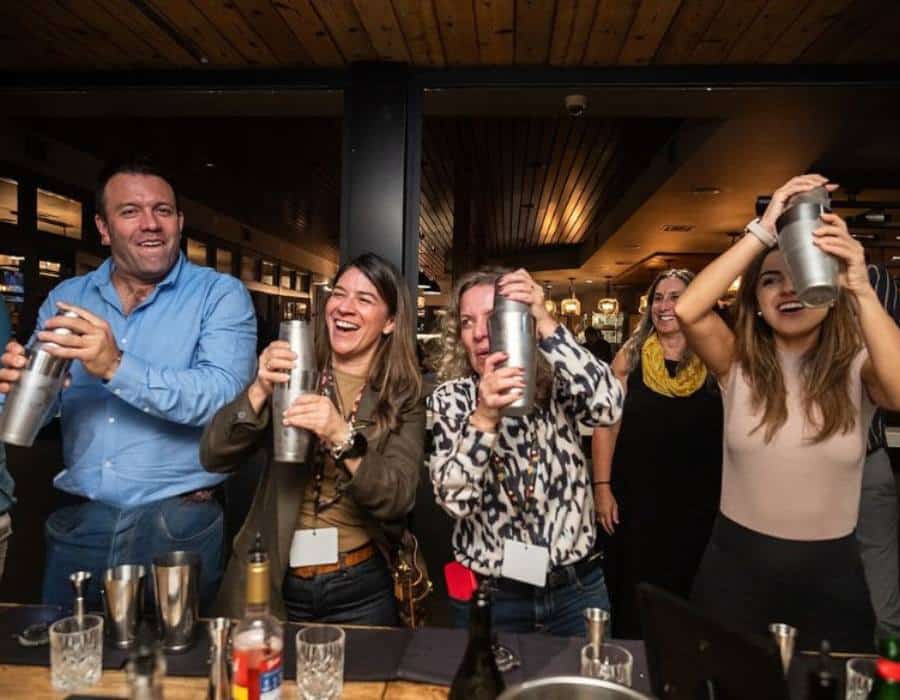 group shaking cocktails during client entertainment dinner for databricks ai summit