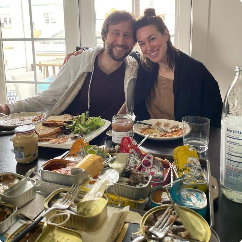 avital and randy behind tins of sardines