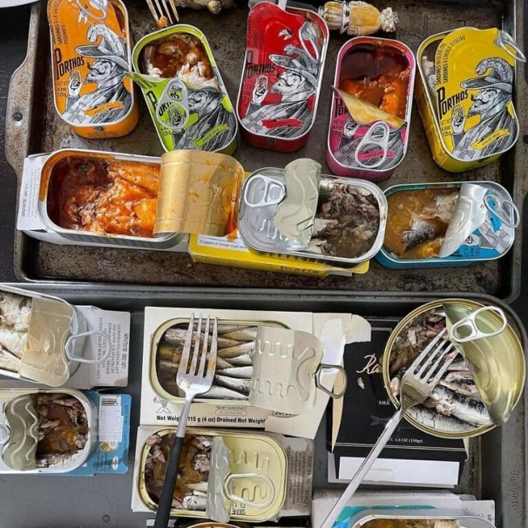 sardine tins open on table