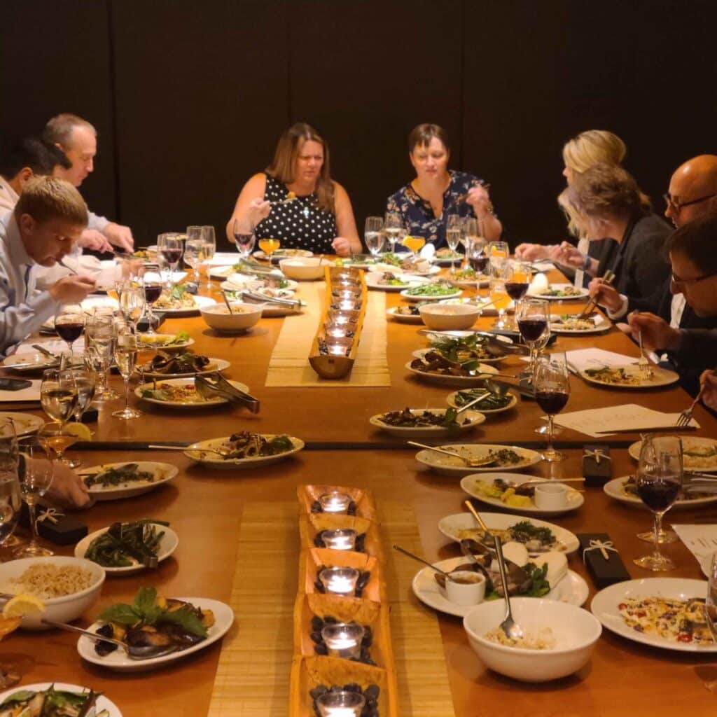 large restaurant table with guest seated during seattle interactive meal