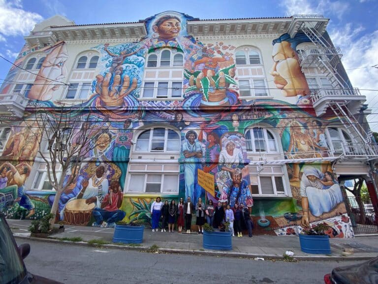 womens building in mission district with food tour group standing in front
