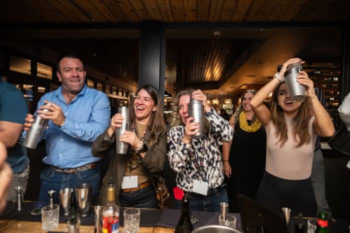 people shaking cocktails during avital's interactive meal, an alternative to standard private dining midtown