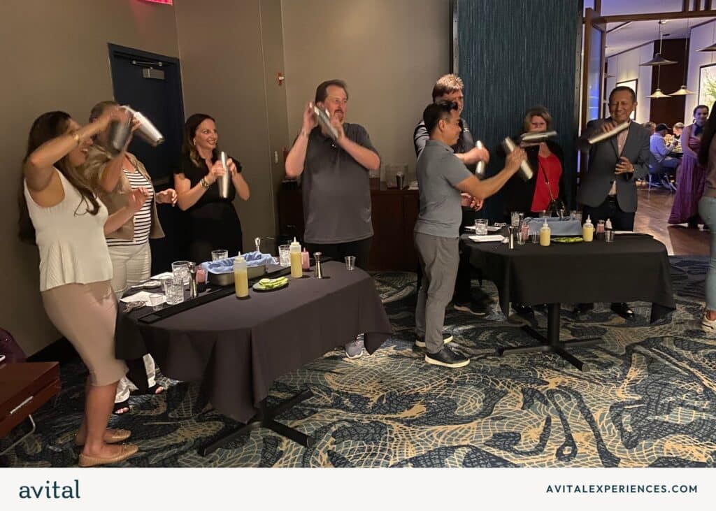 group shaking cocktails at blue fin nyc