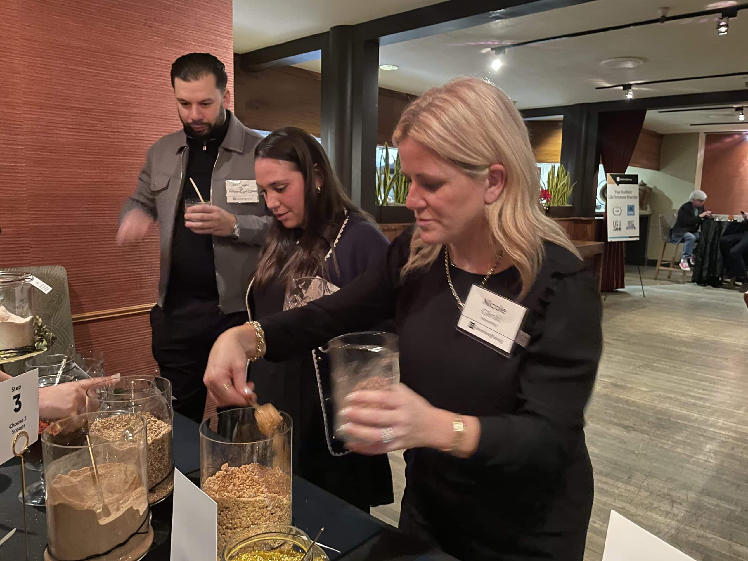 guest adding spices to jar during interactive bar
