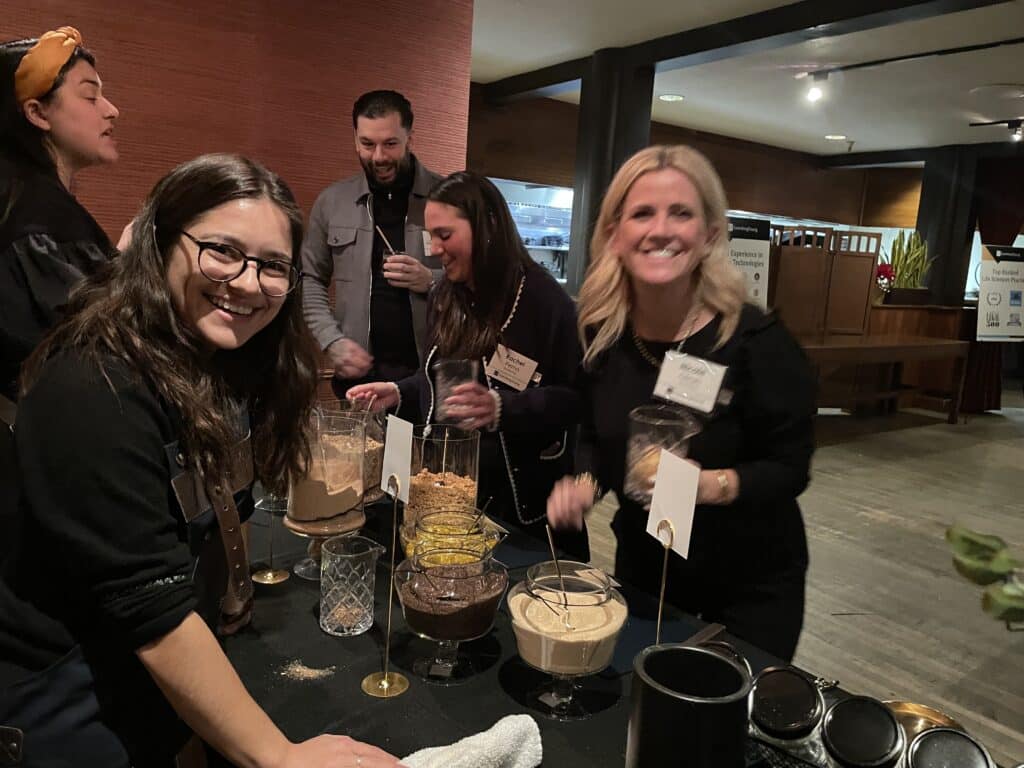 guest and host blending spices during event for large group dining san francisco