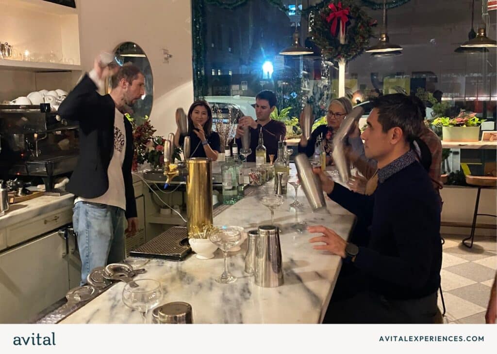 nyc holiday party group shaking cocktails