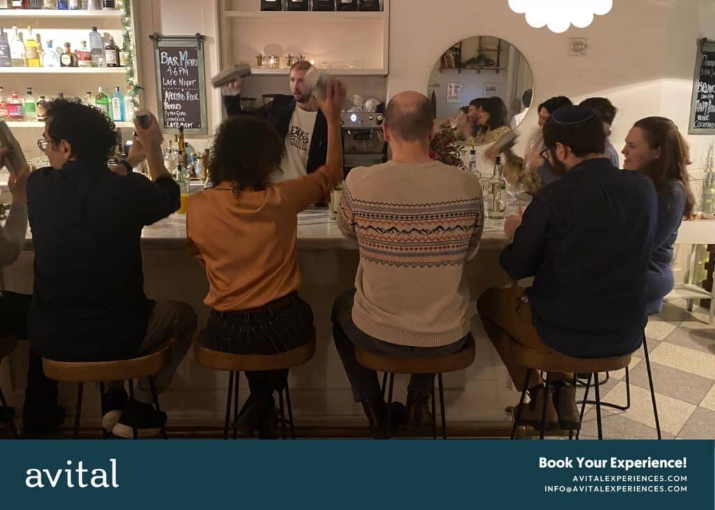 nyc holiday party group sitting at the bar