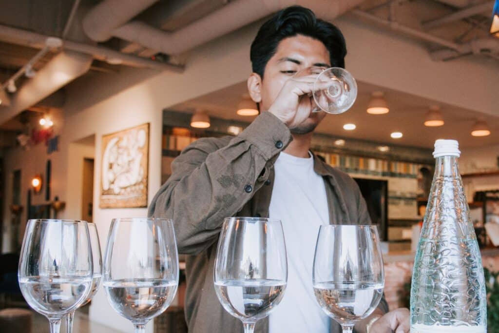 man tasting water like wine during water bar event