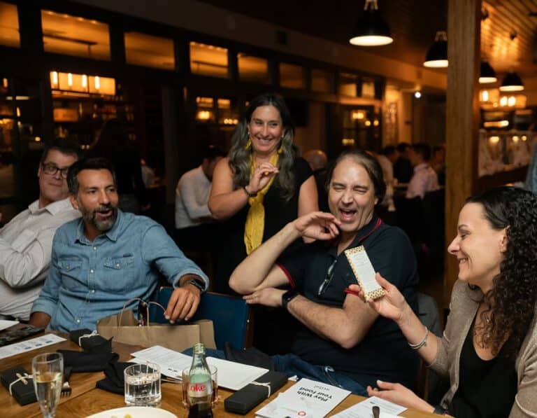 group laughing together during interactive meal in west hollywood