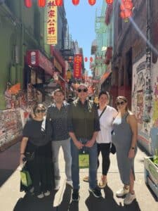 group standing in front of ross alley during chinatown food tour with avital