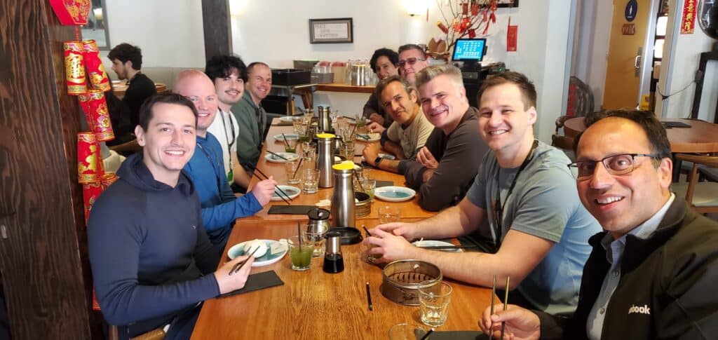 group of men sitting at table during chinatown food tour san francisco
