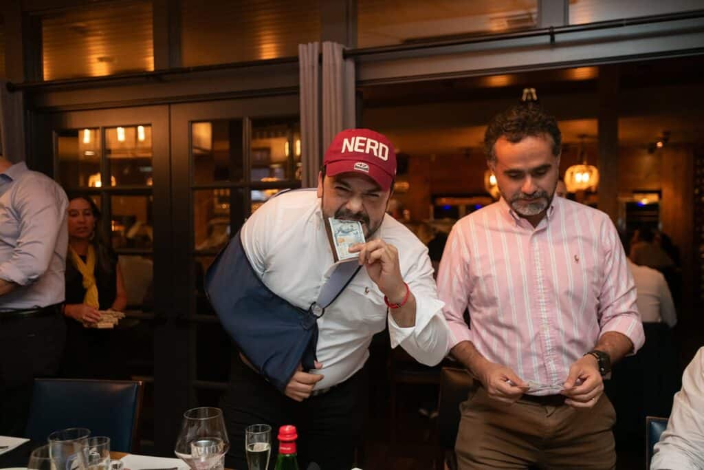 man eating money during chicago private dining event