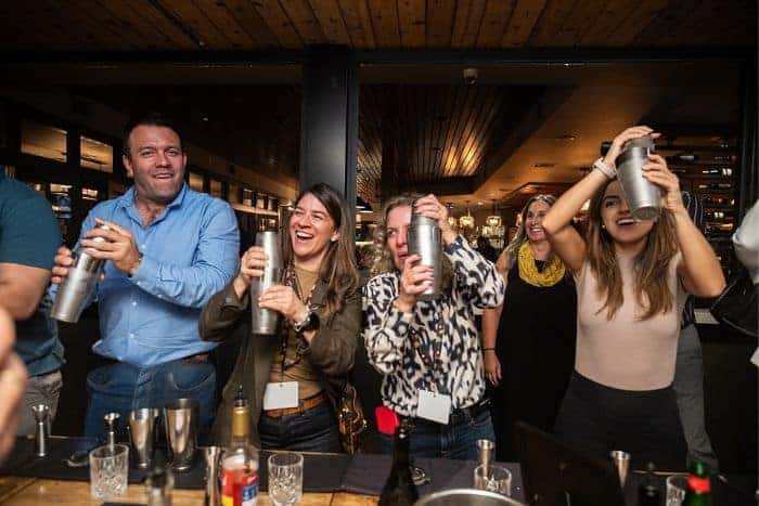 group shaking their own cocktails during event for private dining san jose