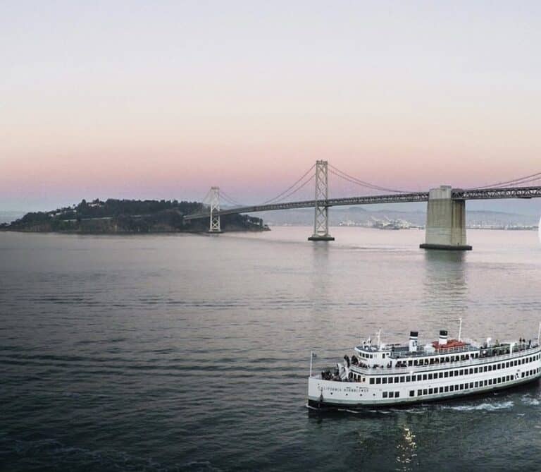 boat in front of golden gate bridge