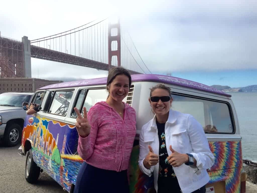 woman and teenage daughter in front of van during groovy tour in san francisco