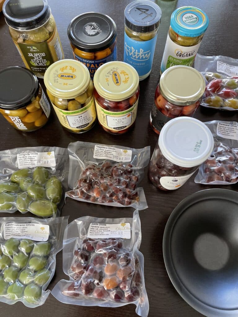 variety of olive sitting on table