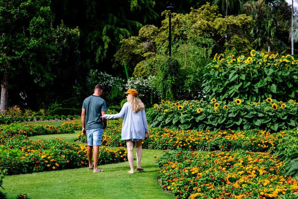 mom and son walking through botanical gardens in nyc