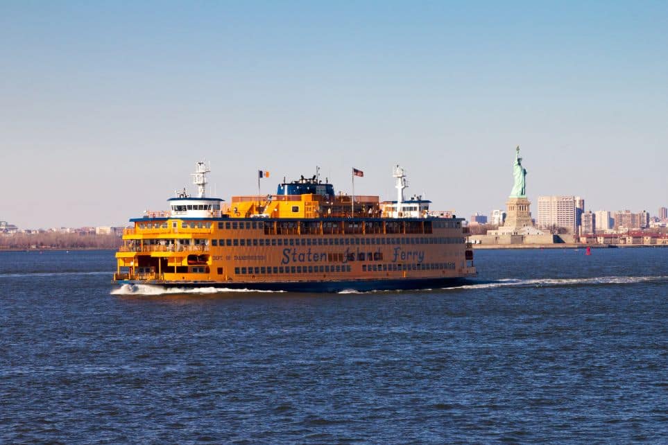 staten island ferry with statue of liberty in background