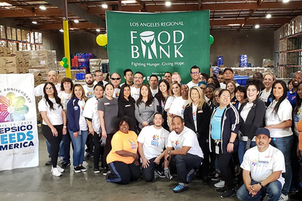 group in front of la food bank, a great corporate holiday party idea in los angeles