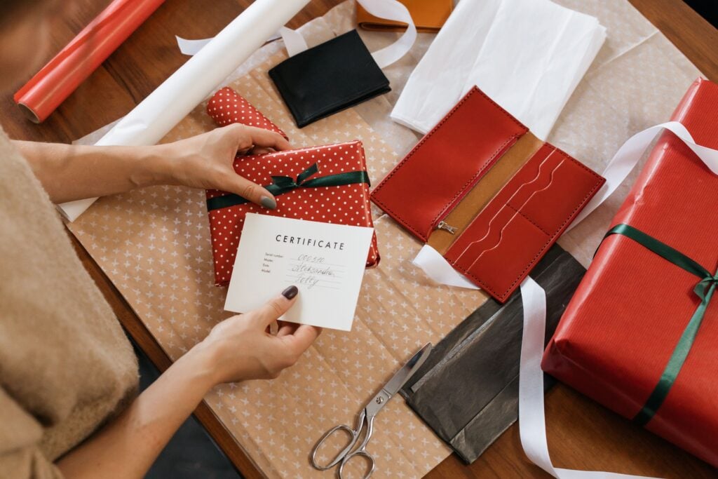 Hands unwrap a gift card