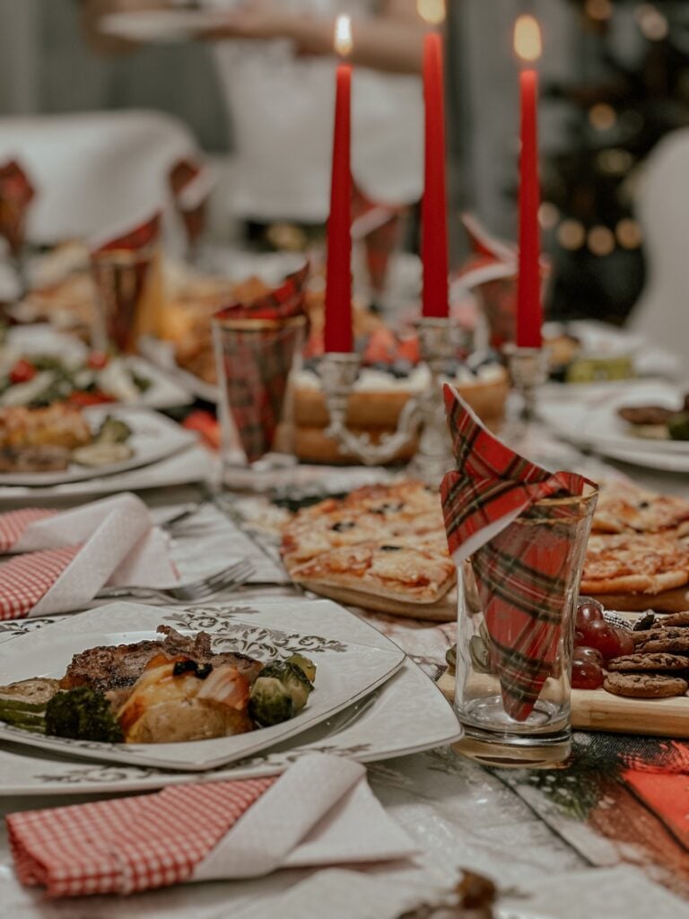 A traditional christmas dinner adorns a festove table