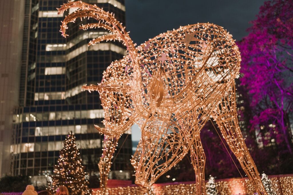 A lit up reindeer adorns a office holiday celebration