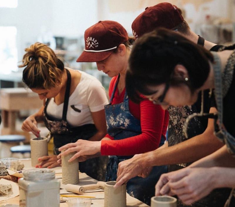 team working on pottery at clay by the bay, one of best team building activities in san francisco