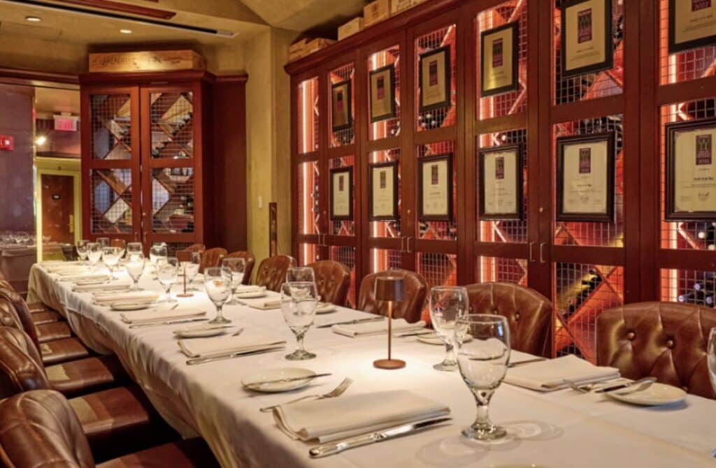 A table laid out with white tablecloth and glassware at Grill 23 & Bar in Boston
