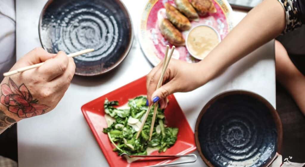 Friends dig into a shared plate at Myers + Chang in Boston