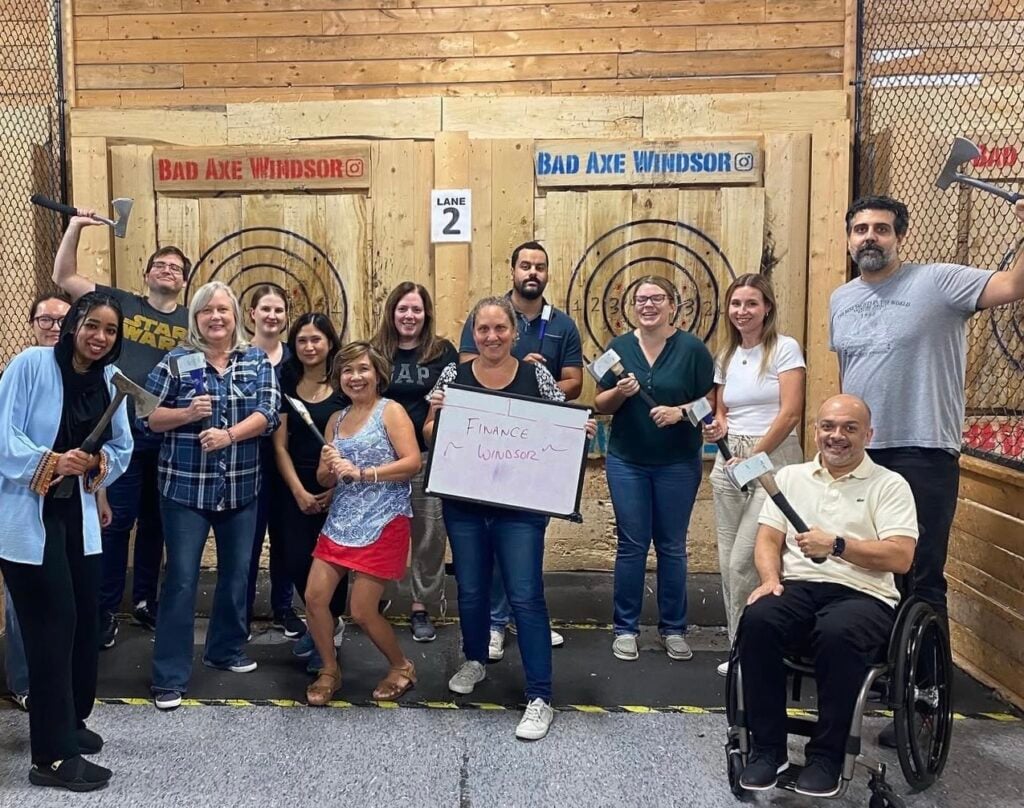 A team poses after having fun at Bad Axe Throwing