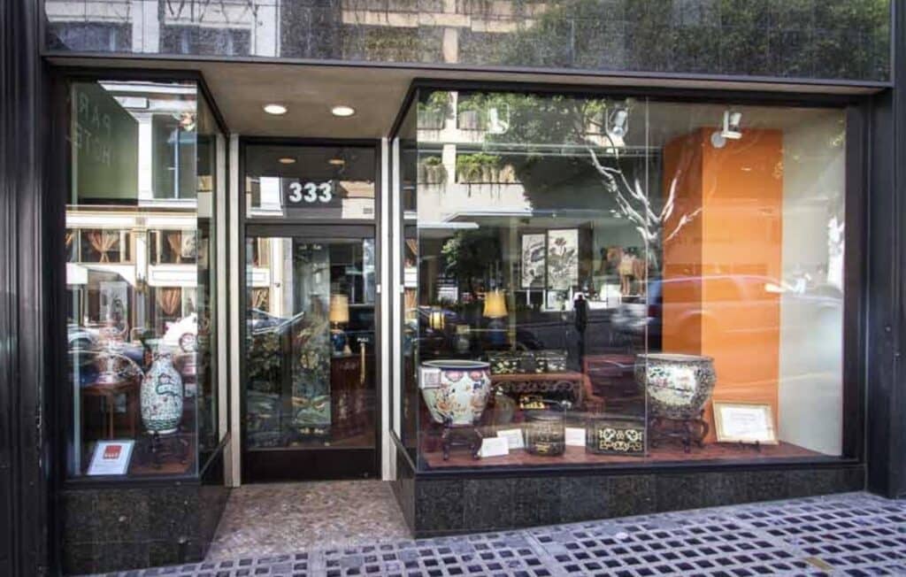 A storefront window of a square in Union square SF