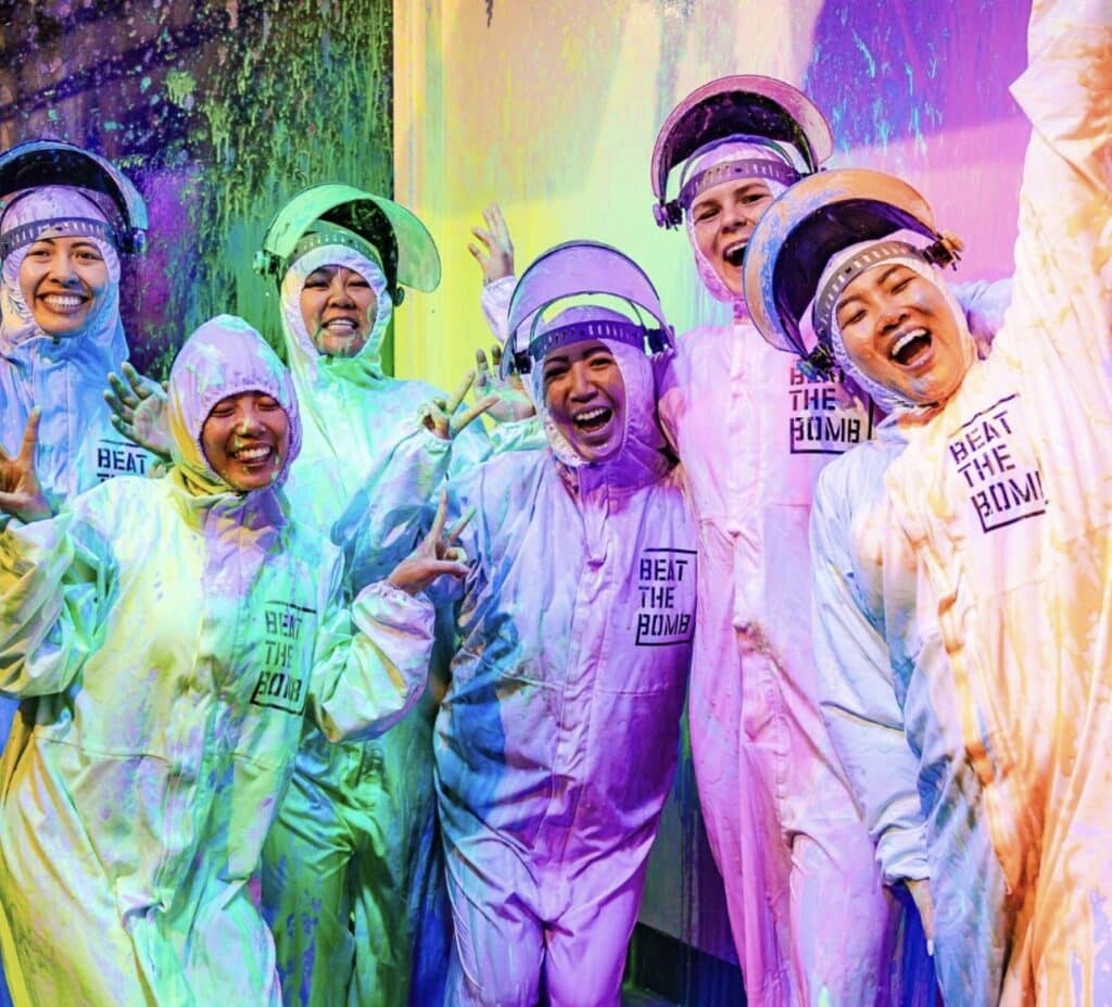 Friends pose in after beating the bomb in Denver