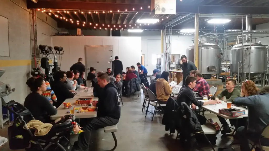 Folks congragated at Denver Game Night playing board games