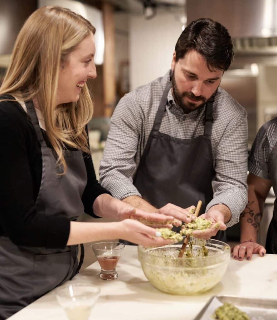 Friends make dumplings at Stir Cooking School