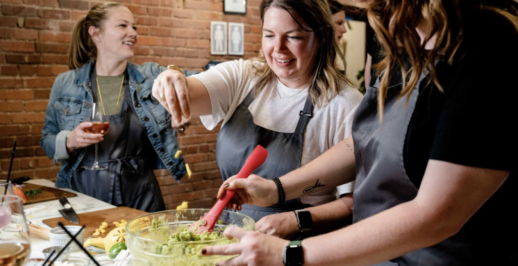 Teams compete to make the best guacamole at Stir Cooking School