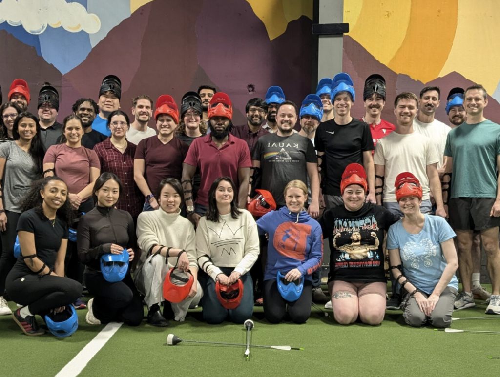 Coworkers pose after a game of dodgeball archery at Archery Games Denver
