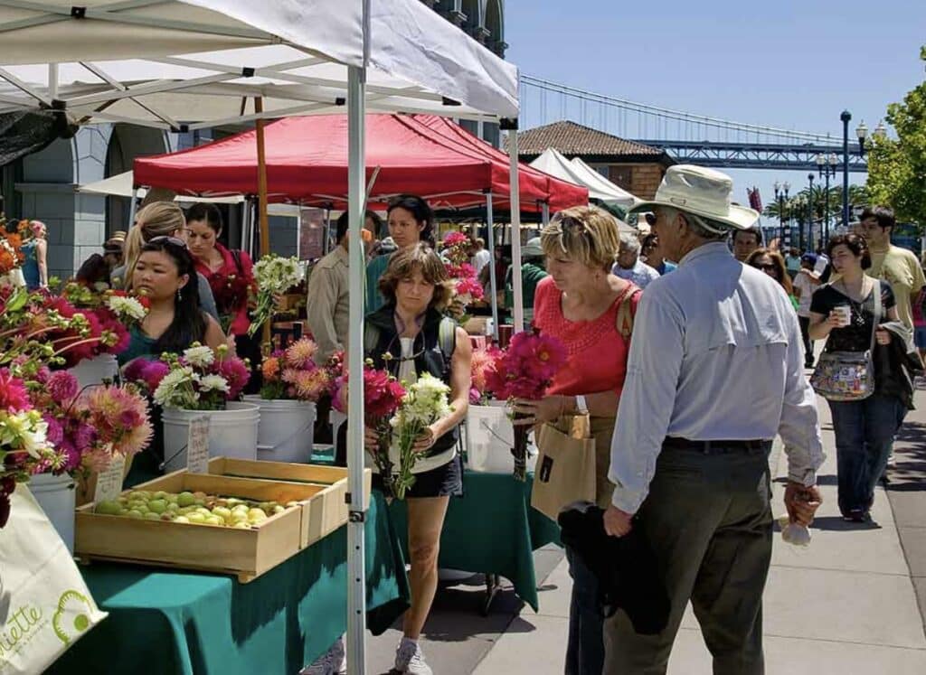 People shop at the Ferry Building Farmer's Market in SF