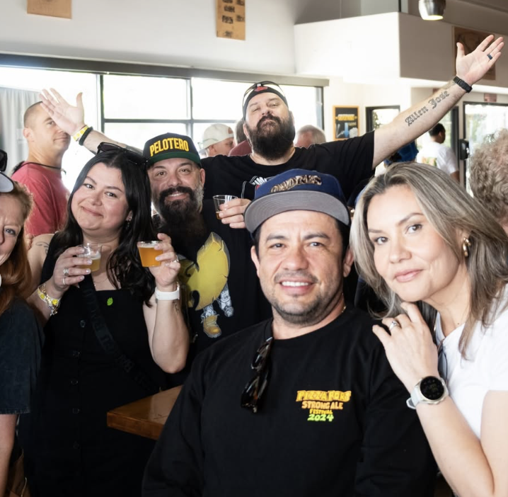 A team celebrates their trivia win at Ballast Point Brewing
